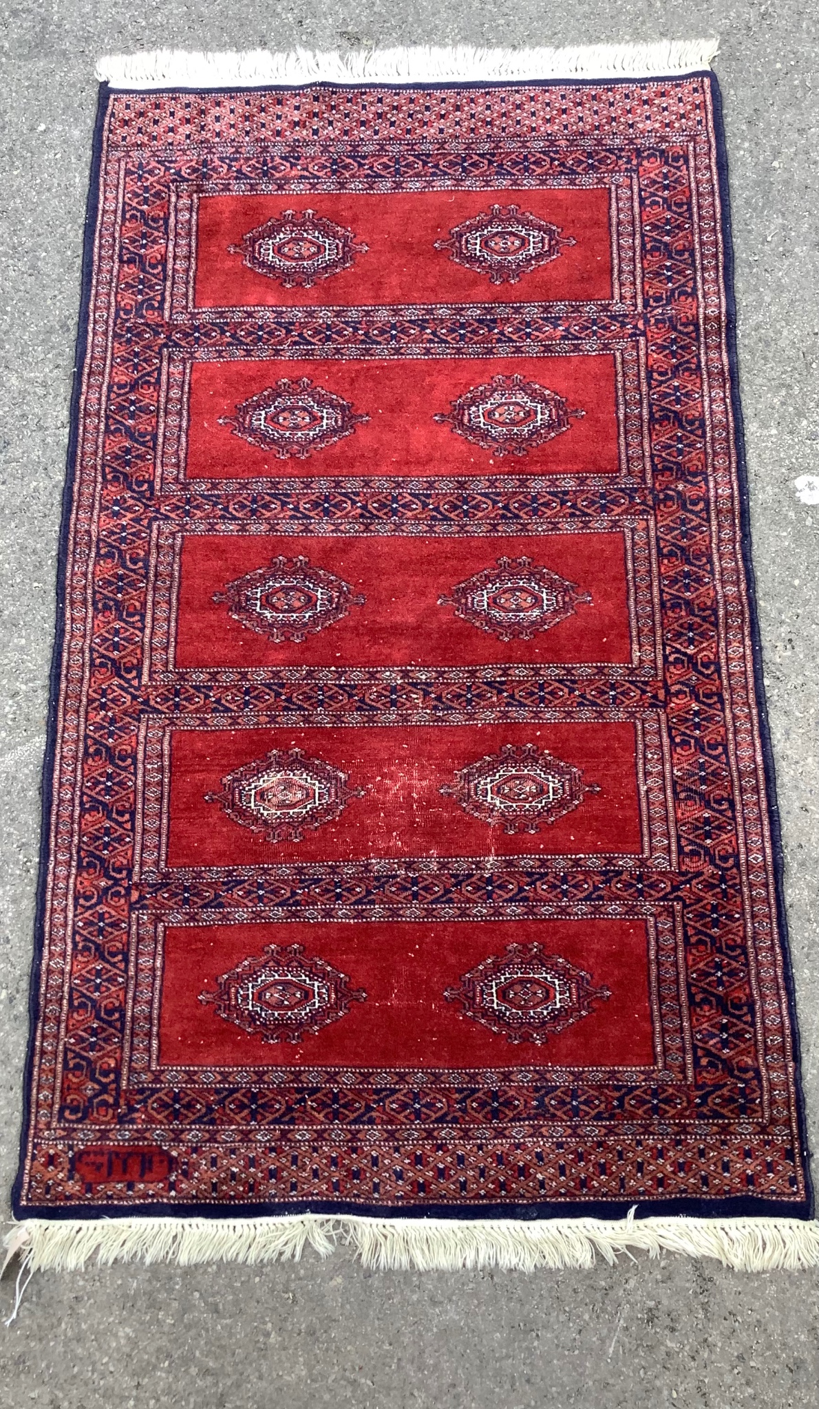 A Bokhara red ground rug, 160 x 93cm